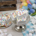 Birthday Cake Marshmallows on a mini cake stand with small mallows tossed around