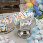 Birthday Cake Marshmallows on a mini cake stand with small mallows tossed around