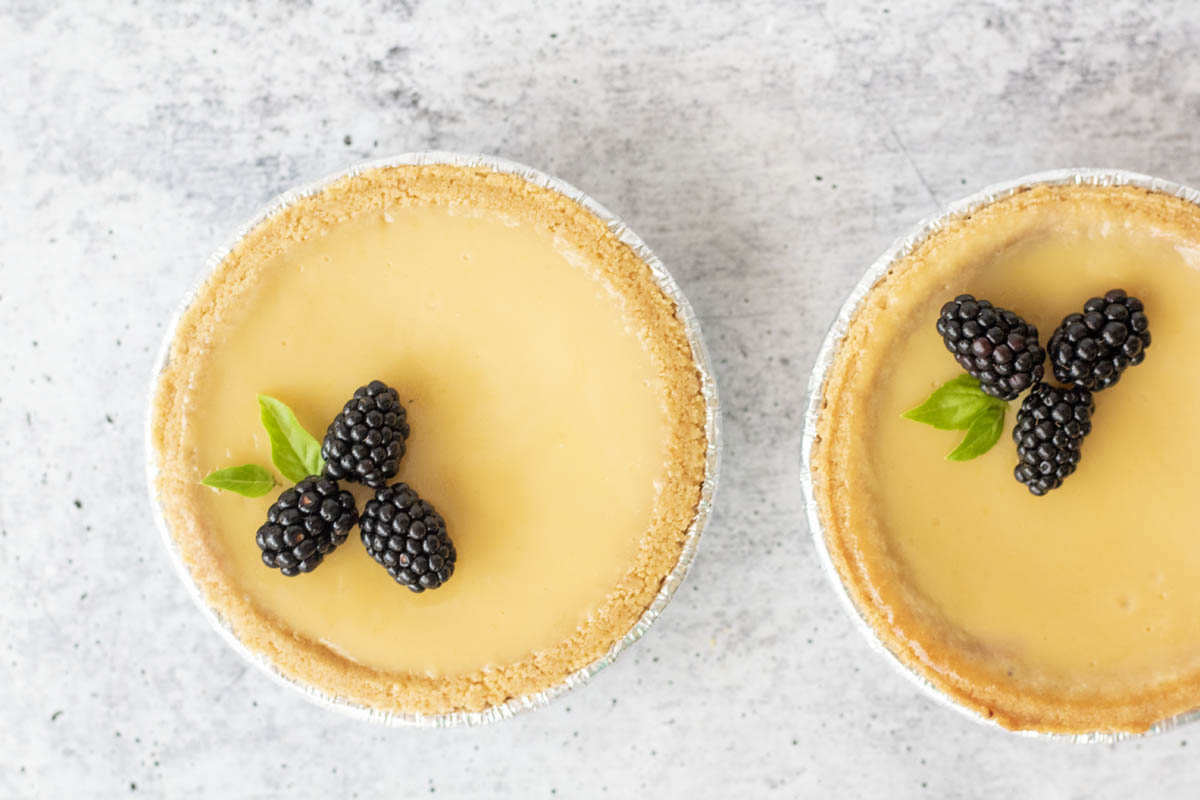 close up of two blackberry lime tarts