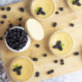 spread of blackberry lime tarts and scattered blackberries