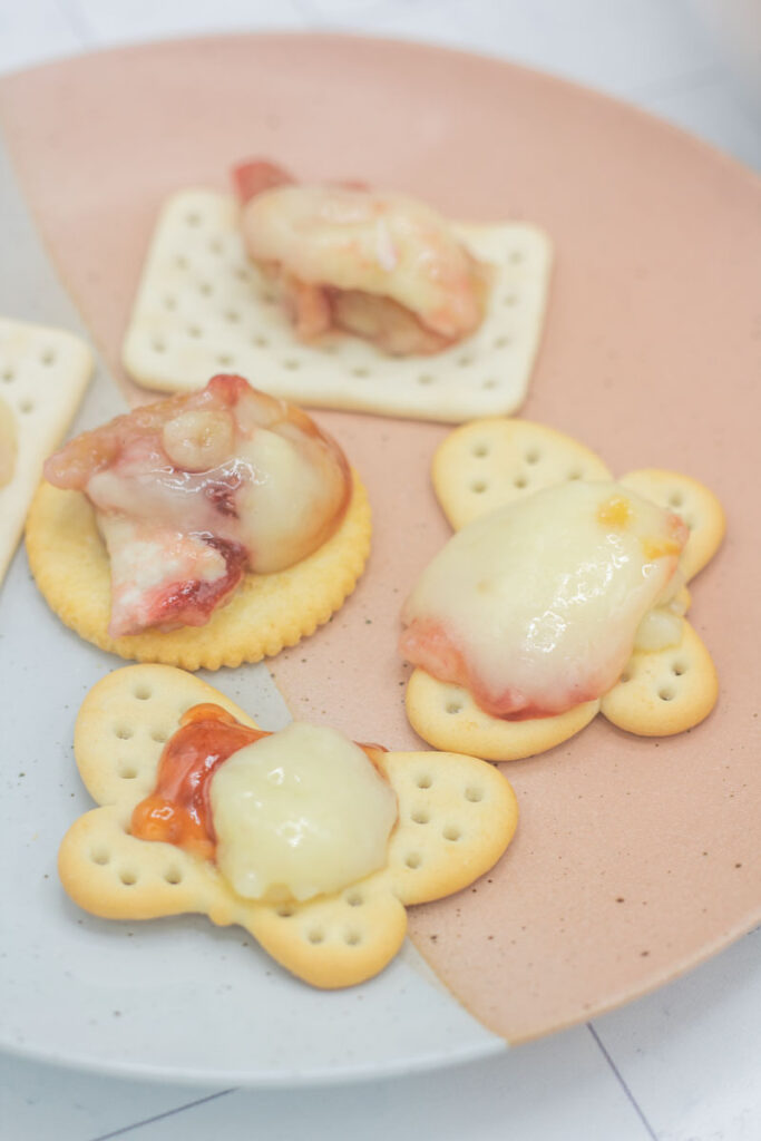 Brie en croute on an assortment of crackers