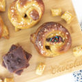 brownie batter stuffed pretzels on a cutting board