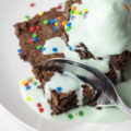 cutting into brownies with mint ice cream melting