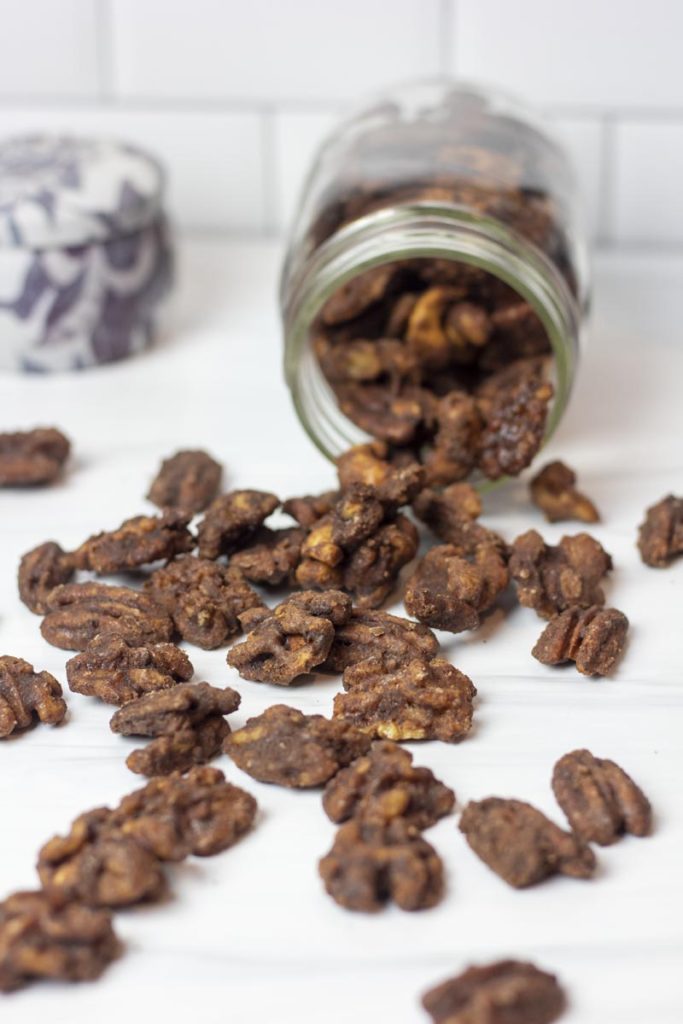 candied cinnamon nuts spilling from a mason jar