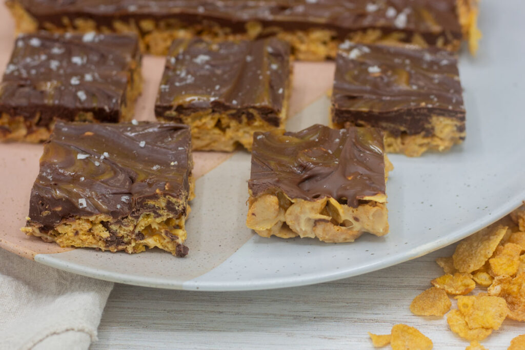 Caramel cornflake bars arranged on a plate