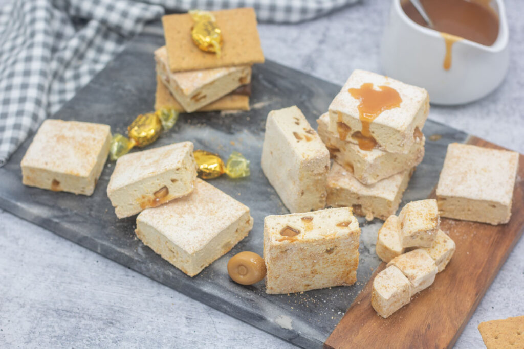 Variety of shapes and data-lazy-sizes of caramel crunch marshmallows and s'mores