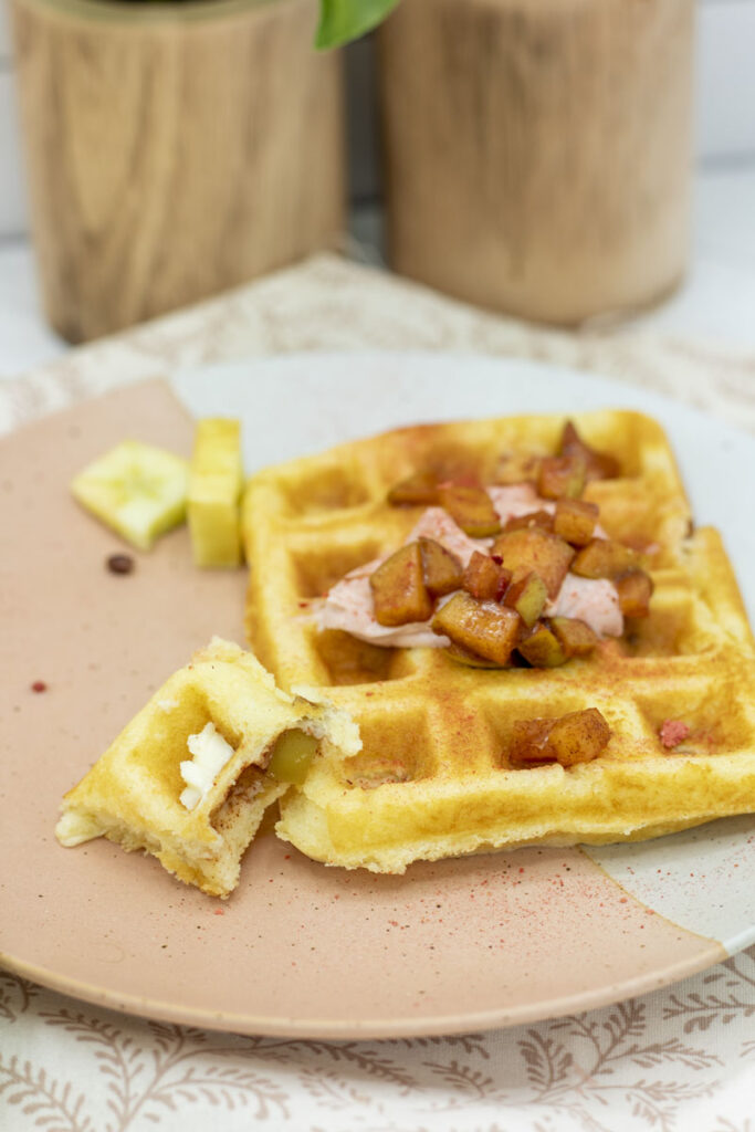 A single waffle topped with cinnamon apples