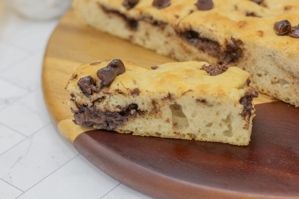 Close up of a slice of chocolate chip focaccia