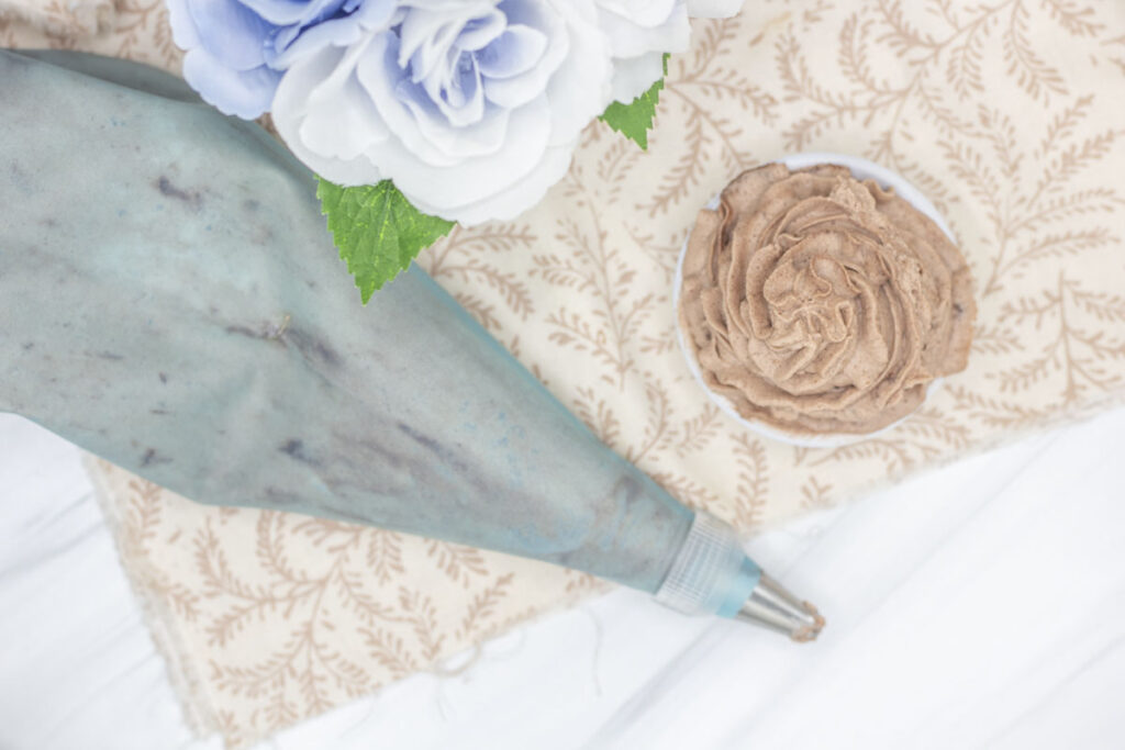 A piping bag alongside chocolate whipped cream