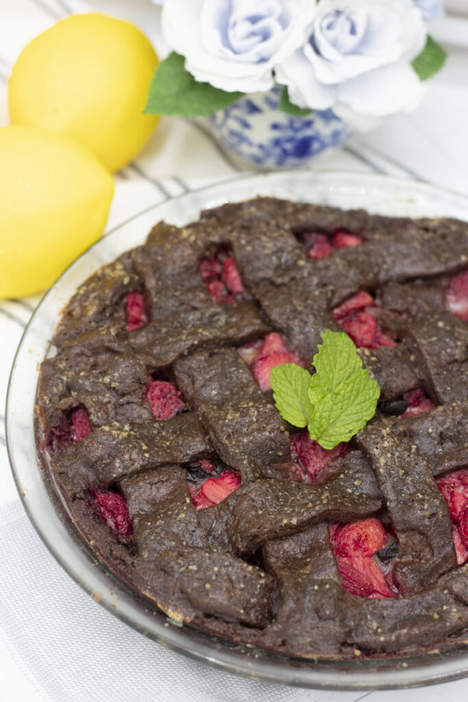 Chocolate lattice strawberry pie with fresh mint leaves