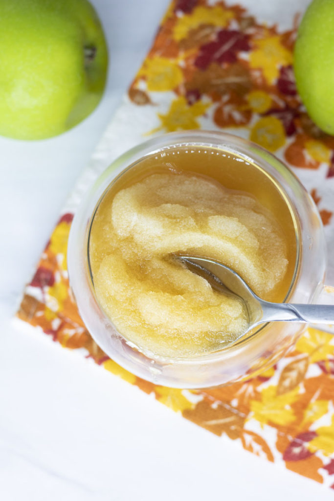 spoon dipping into apple cider slushee