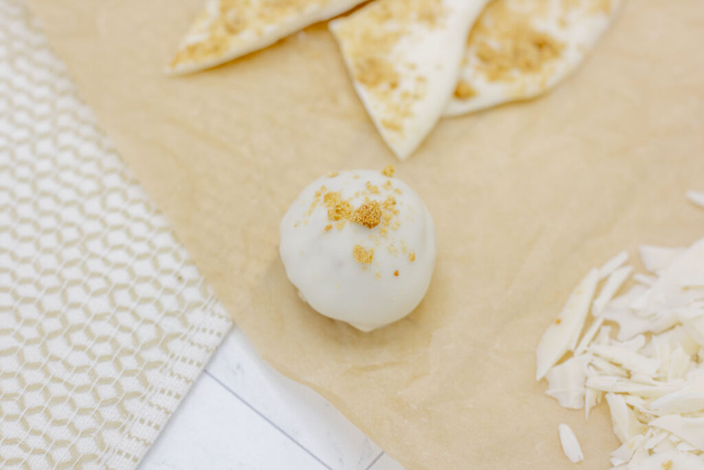 Cinnamon bun truffle on brown parchment paper