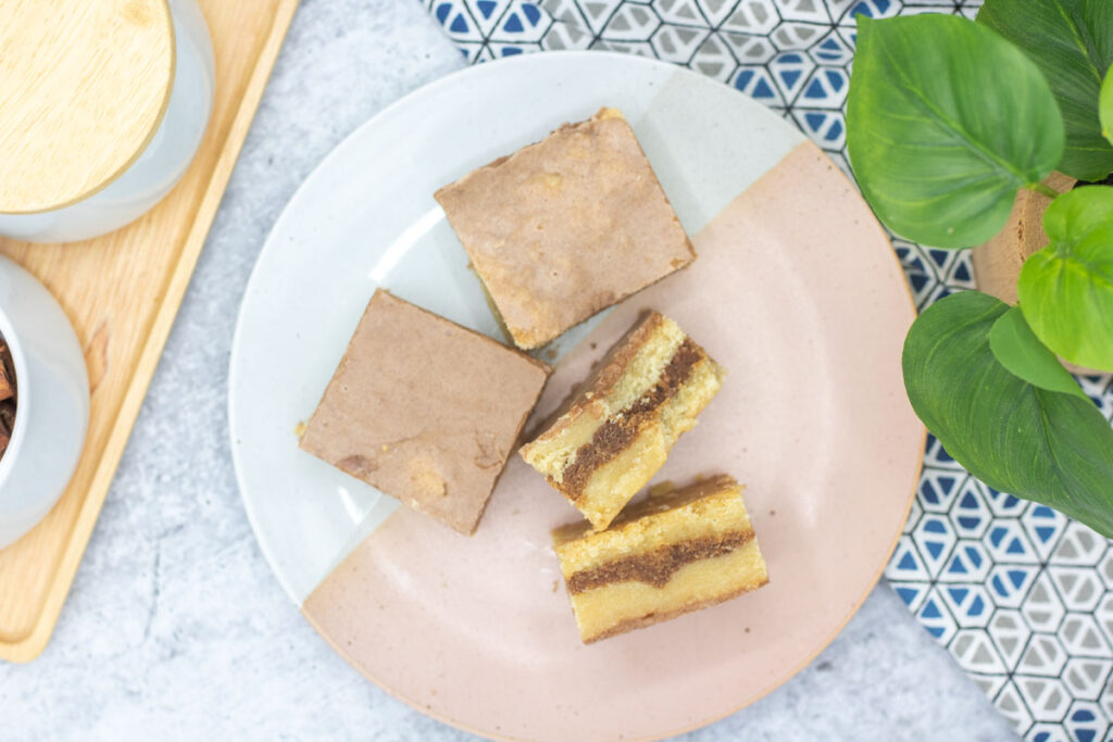 Various brown sugar cinnamon pop tart bars laid on a plate
