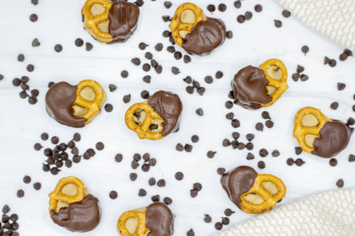 Cookie dough pretzel bites scattered amidst mini chocolate chips