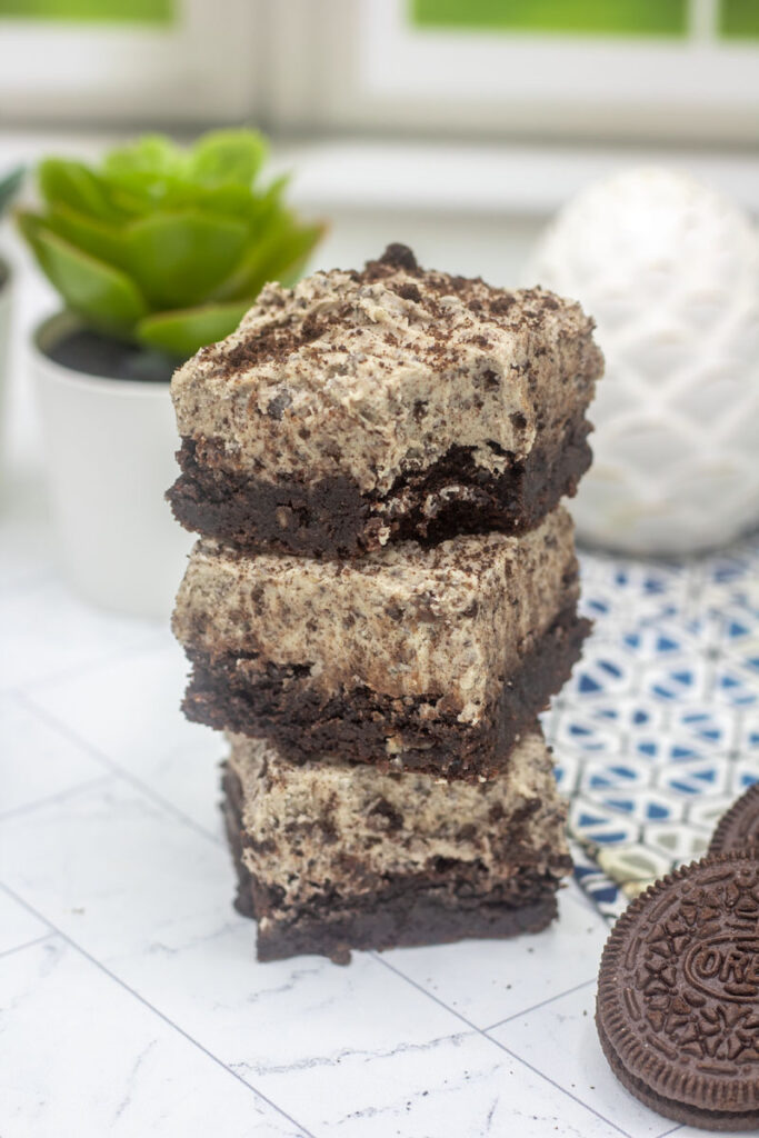 Stack of cookies and cream icing brownies
