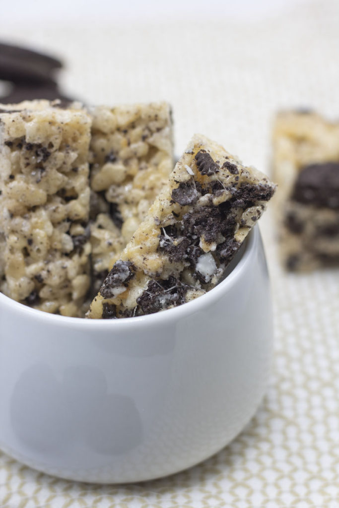 cookies and cream rice krispies cut into sticks in a jar
