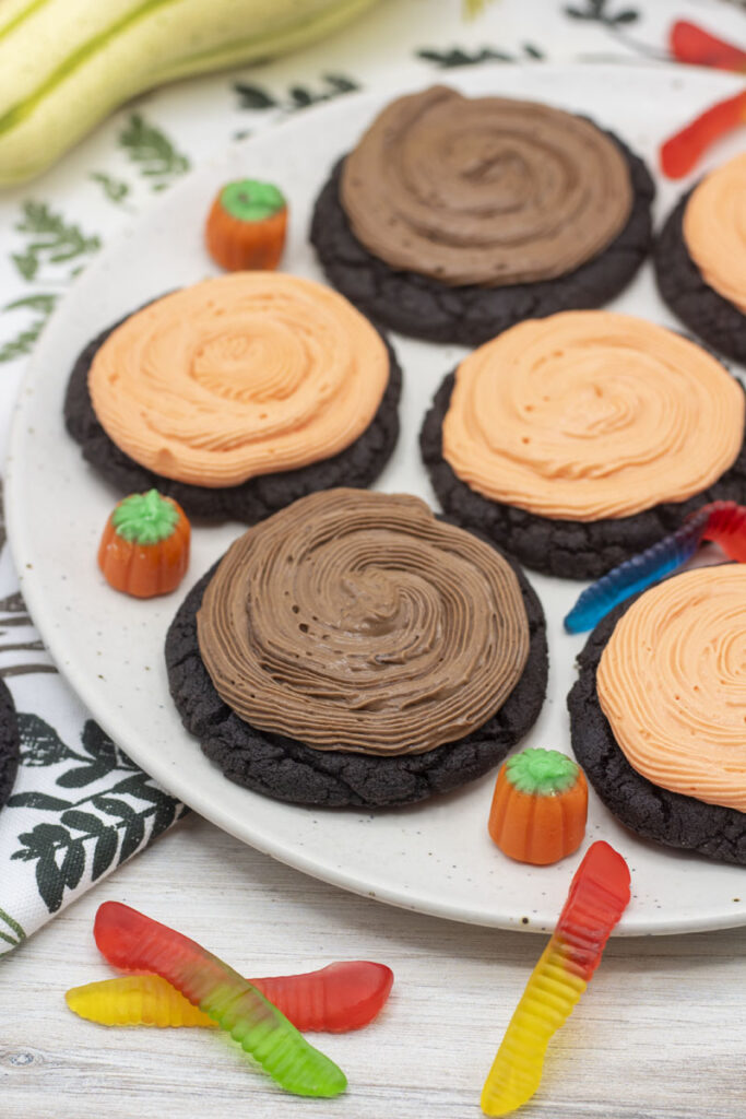 Dirt cup cookies with brown chocolate icing and orange vanilla icing