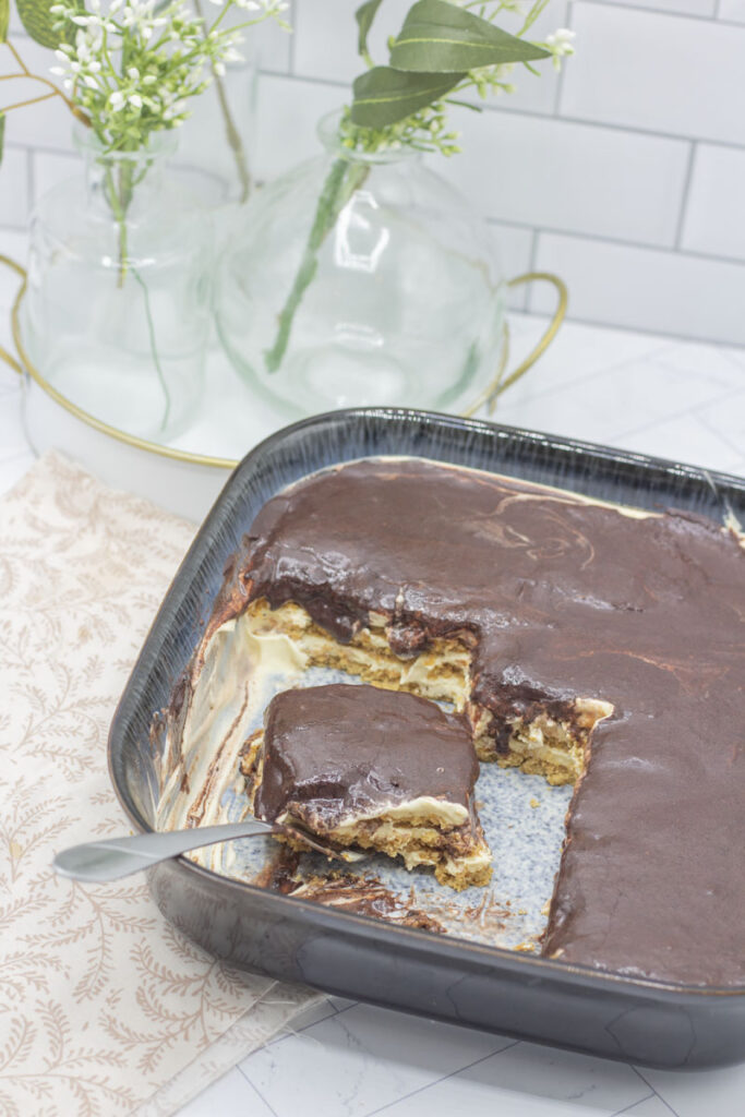 Slice cut from pan of no bake eclair cake