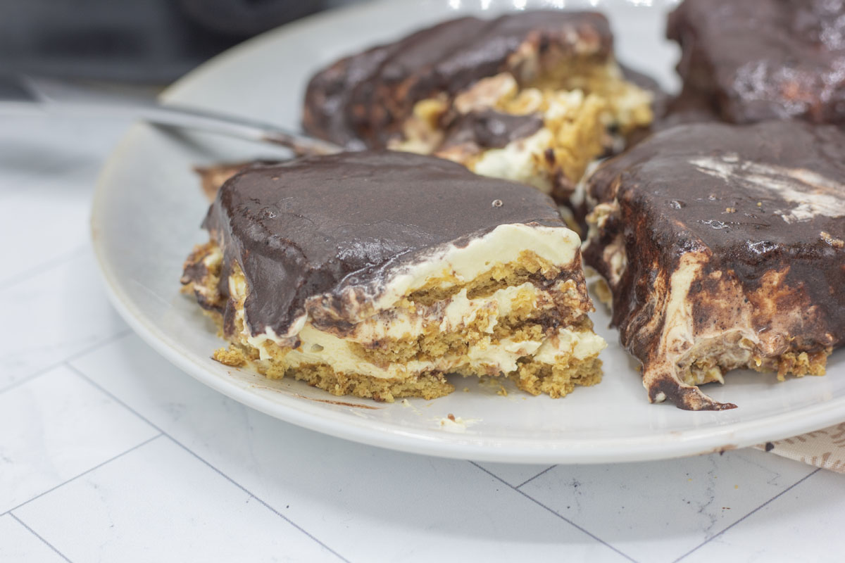 Slice of bake chocolate eclair icebox cake