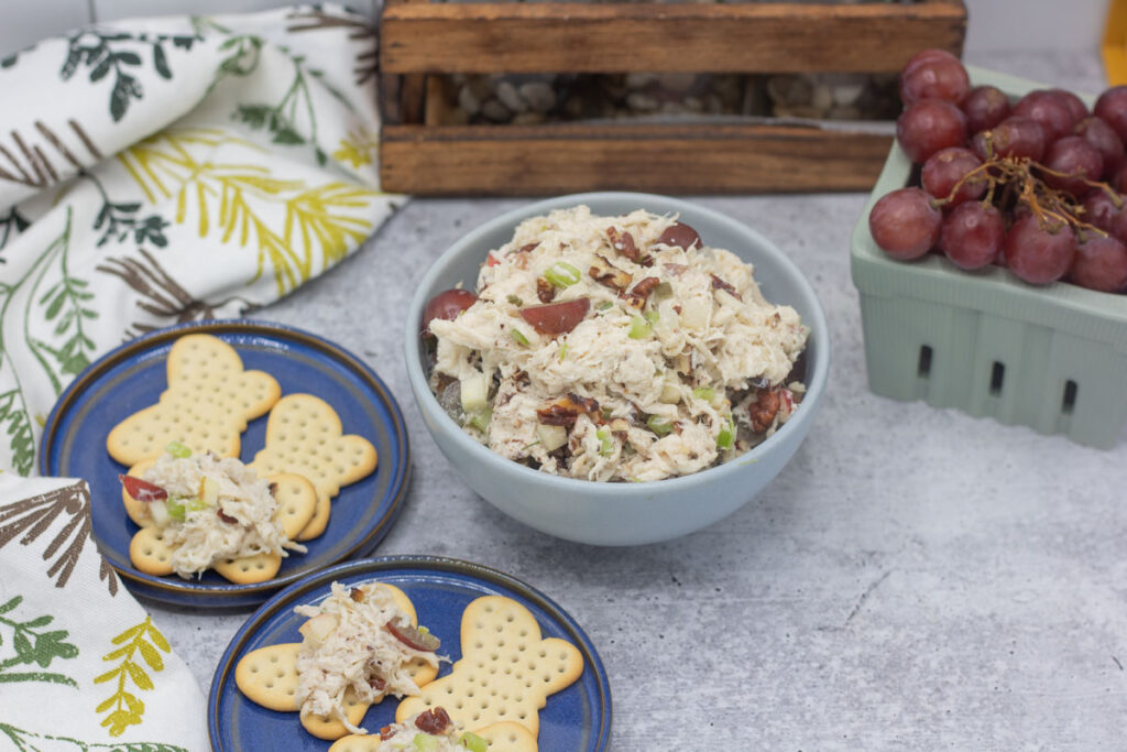 Fancy nancy chicken salad with assorted crackers and grapes