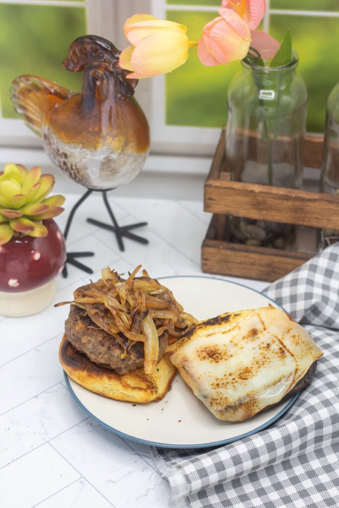 Burger with onions on toasted bun