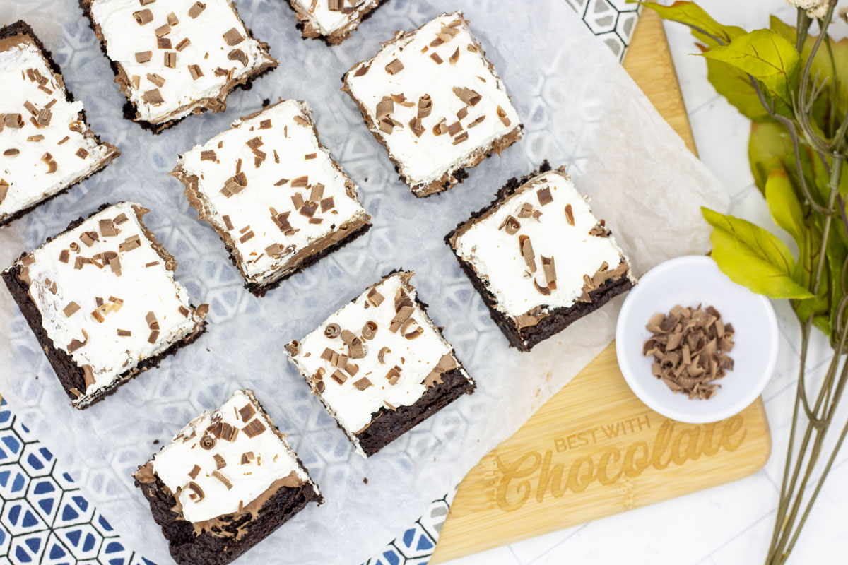 French silk brownies topped with chocolate curls