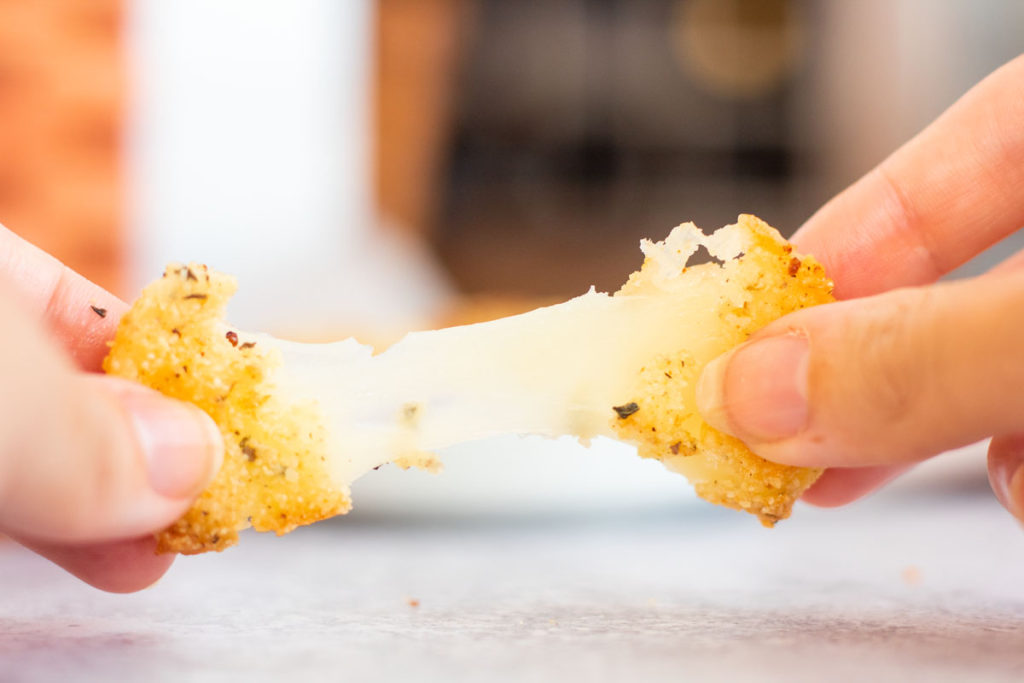 stretching fried cheese