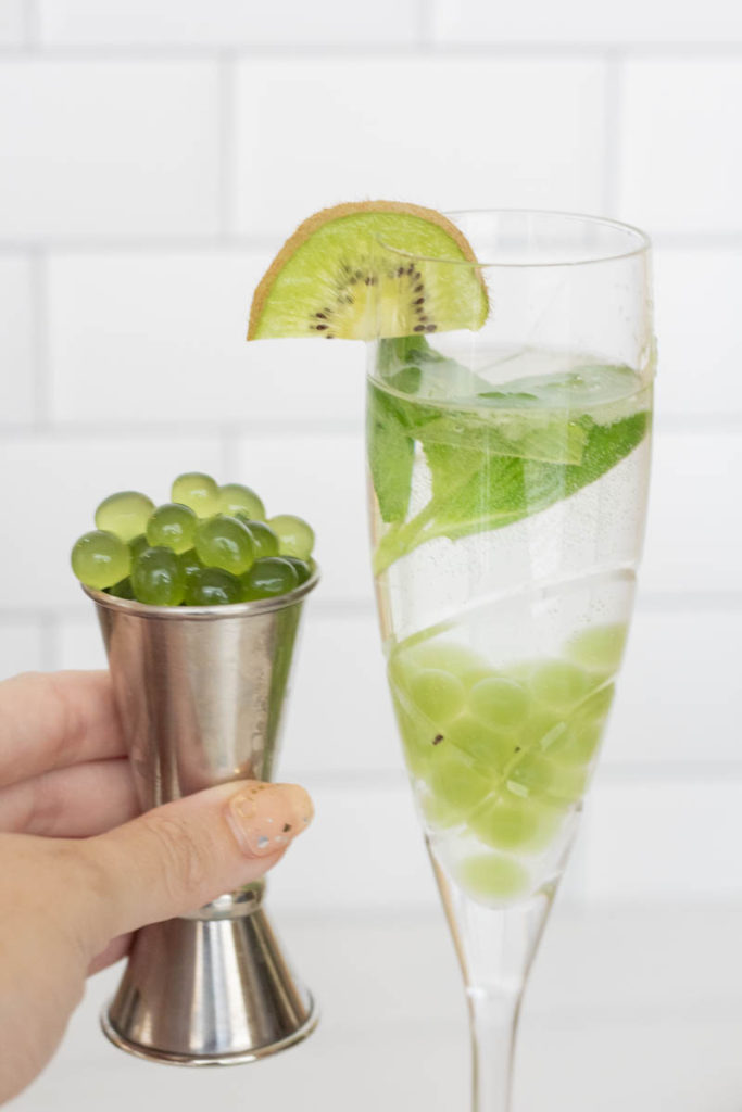 frog spawn cocktail with kiwi popping boba