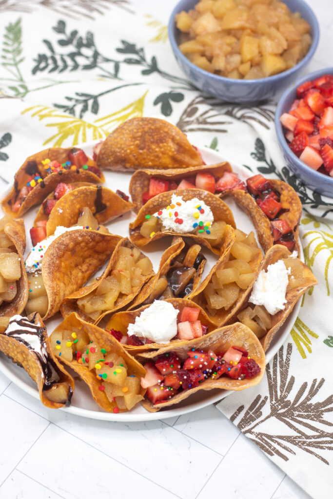 Colorful dessert tacos with toppings