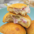 Close up of a torn rosemary ham and swiss biscuit bomb