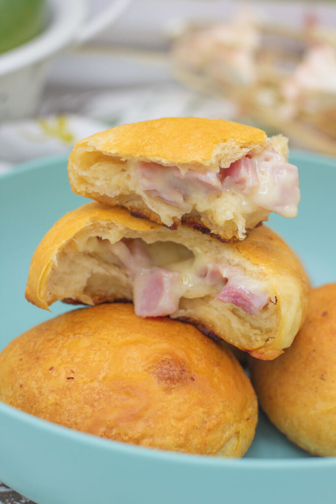 Close up of a torn rosemary ham and swiss biscuit bomb