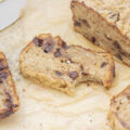 Slice of healthy chocolate chip banana bread with a bite taken out of it