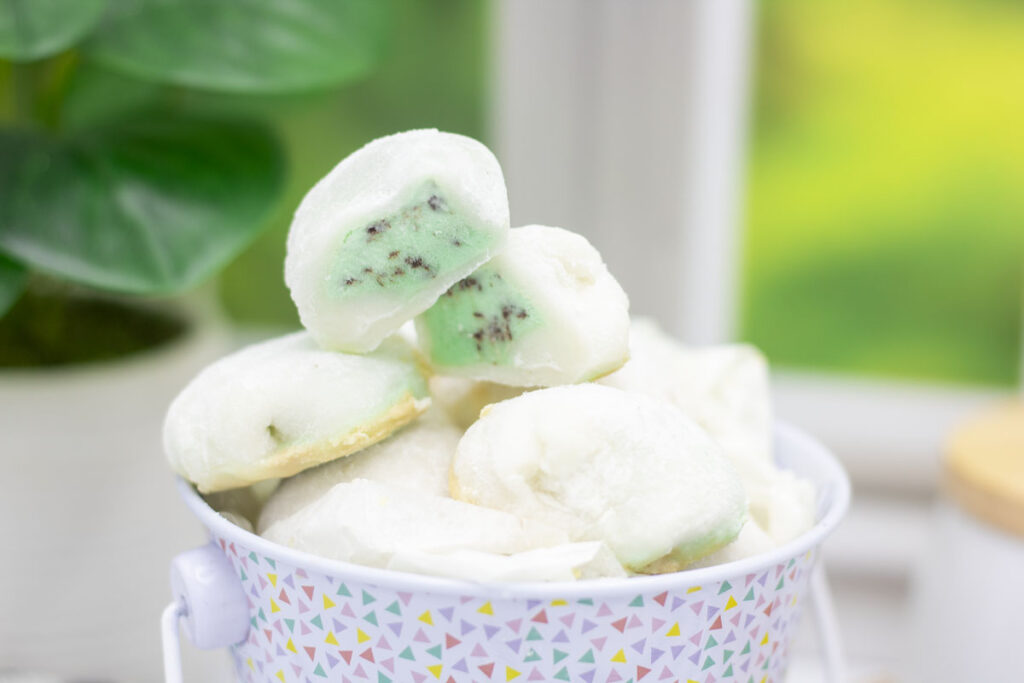 mint chocolate chip ice cream mochi stacked on a pile of mochi