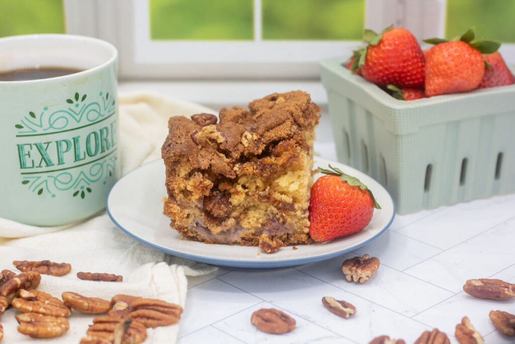 Layered innkeepers coffee cake with strawberries, cinnamon swirl, and pecans