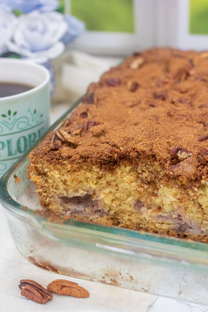 Big and fluffy coffee cake with swirls of cinamon and fresh strawberries