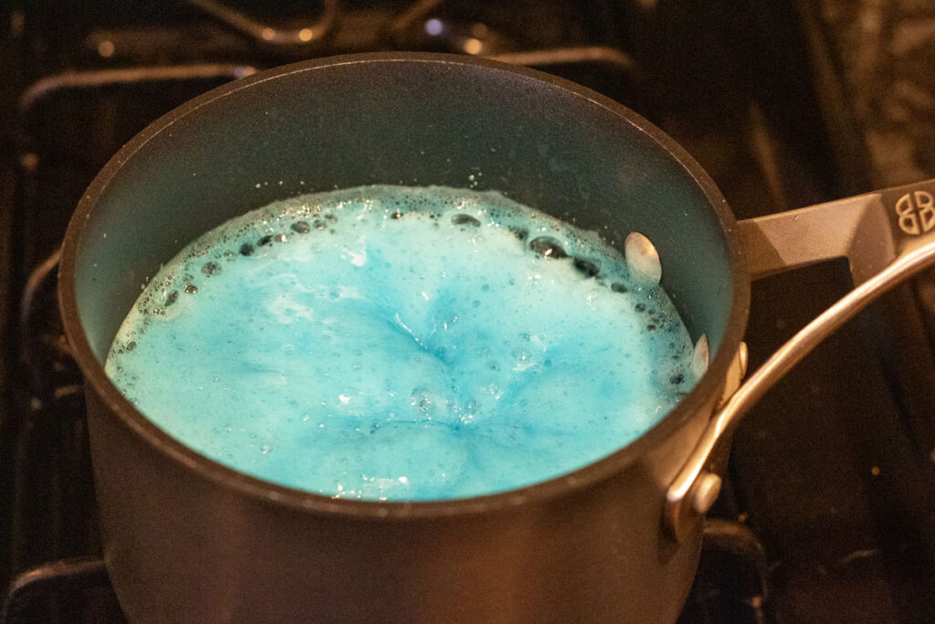 Boiling blue raspberry lemonade jelly filling for chocolate frogs