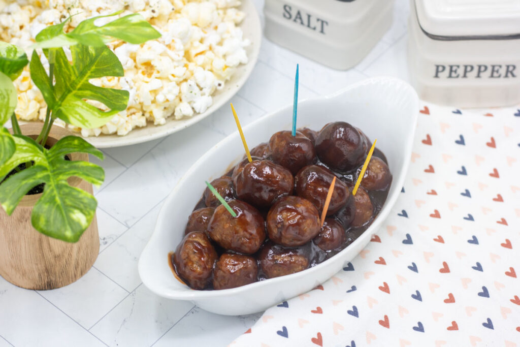 Serving dish full of jelly bbq meatballs