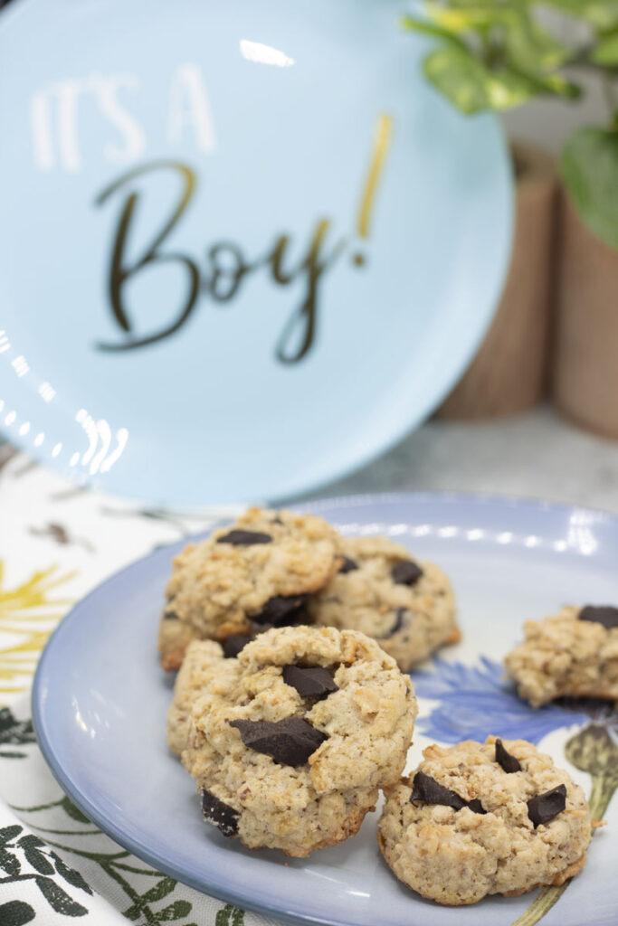 Cookies on a blue plate with a "it's a boy" plate behind