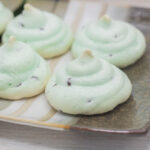 Piped mint chocolate chip meringues