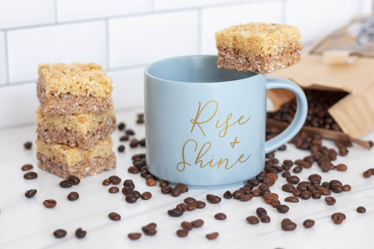 mocha rice krispie treats on a mug that reads rise and shine