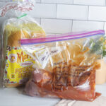crock pot pulled pork new momma meal, packed into a ziplock bag with instructions written on it