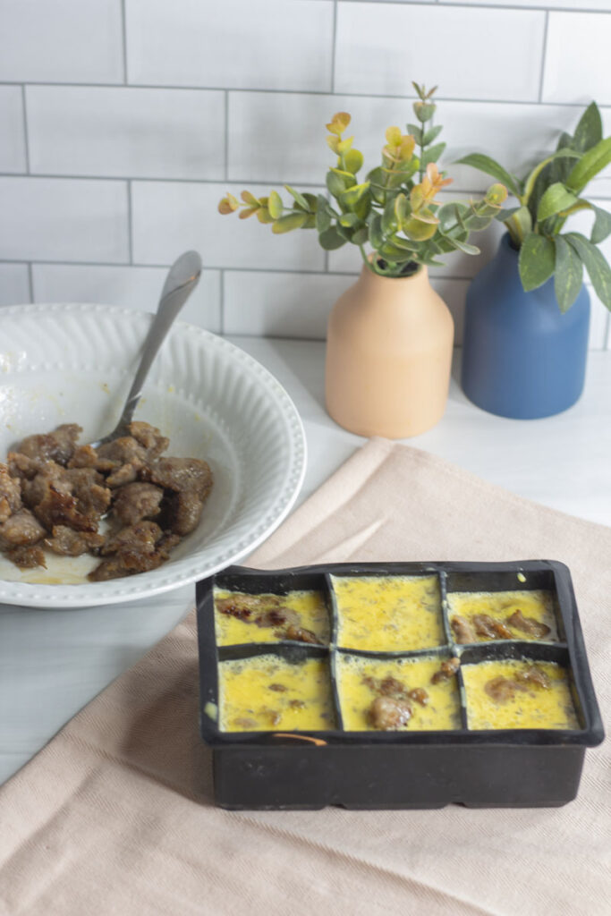 Eggs and sausage in ice cube trays, perfect for new momma meals: freezer breakfast casserole
