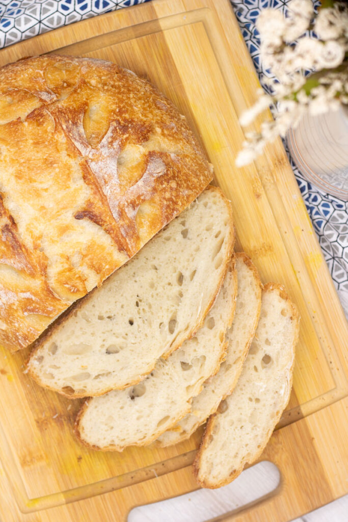 Sliced no-knead sourdough bread loaf