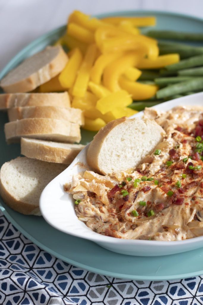 Caramelized onion bacon dip with veggie and bread spread