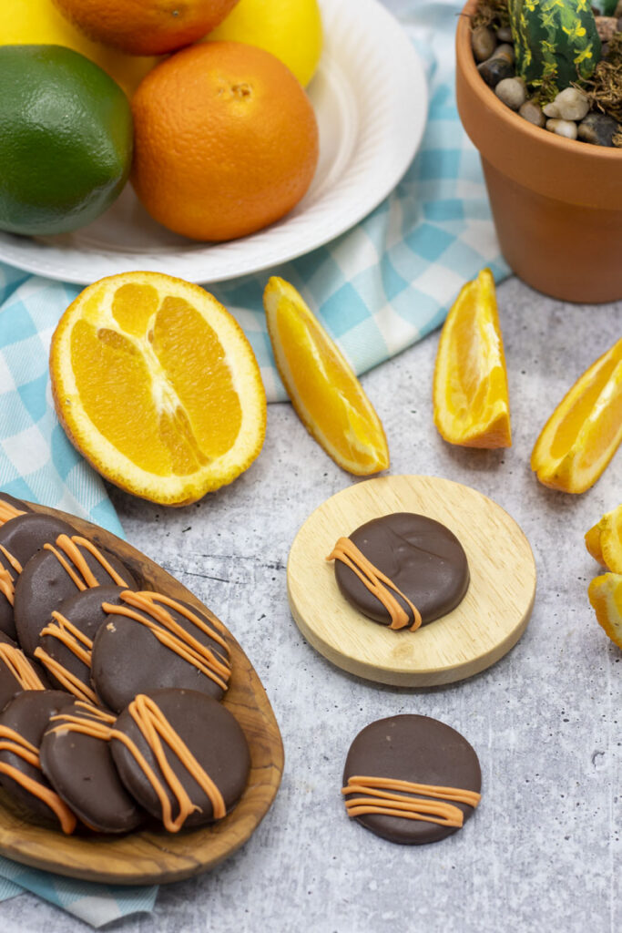 Orange chocolate patties surrounded by orange slices