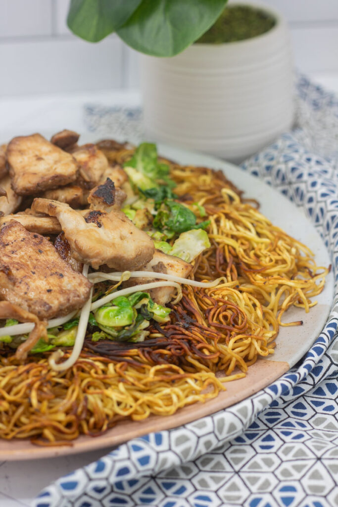 Plate of noodles with chicken and vegetables