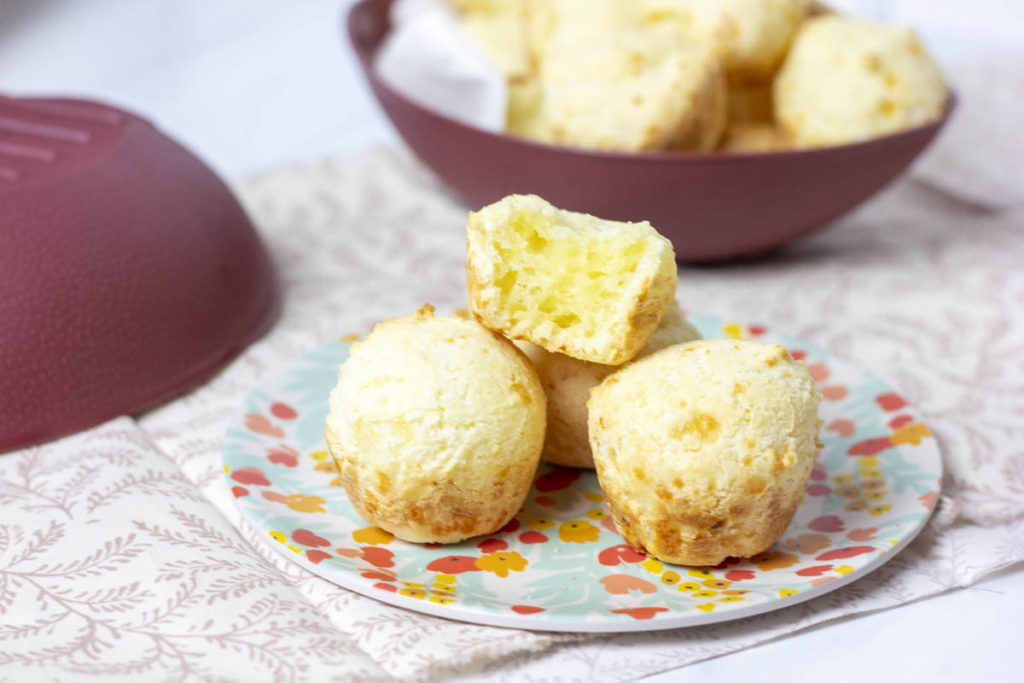 pao de queijo with a bite taken out of one