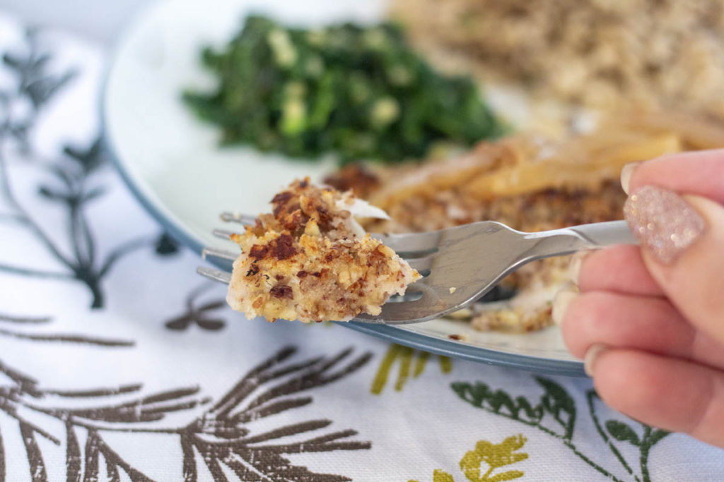 a bite of pecan crusted trout on a fork