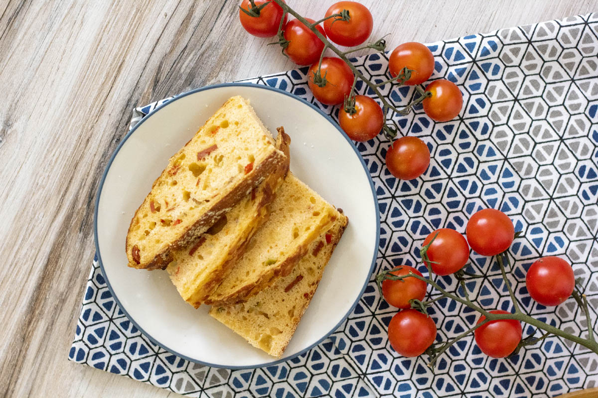 pizza loaf with cherry tomatoes scattered around