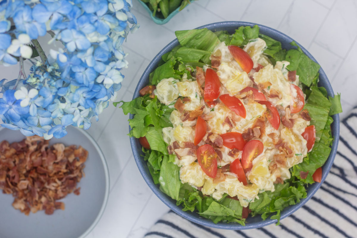 potato salad with bacon bits in a bowl